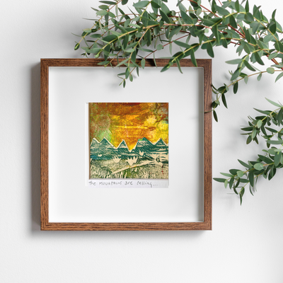 the mountains are calling in this original pretty clever fabric art print with yellows, greens and reds