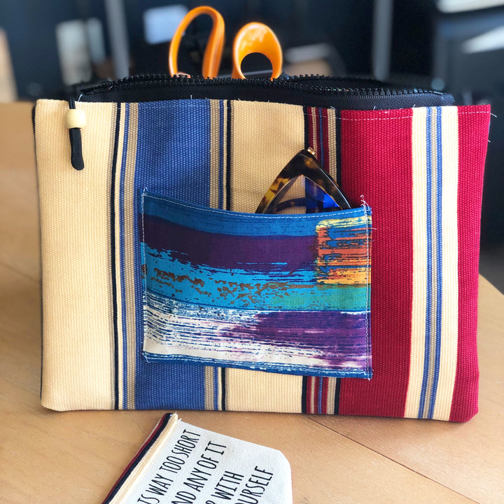 striped blue, yellow and red zip bag pouch