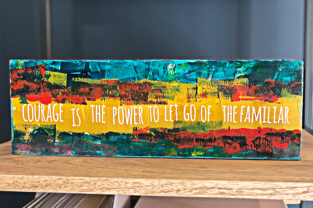 courage is the power to let go of the familiar - wood panel art