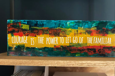 courage is the power to let go of the familiar - wood panel art