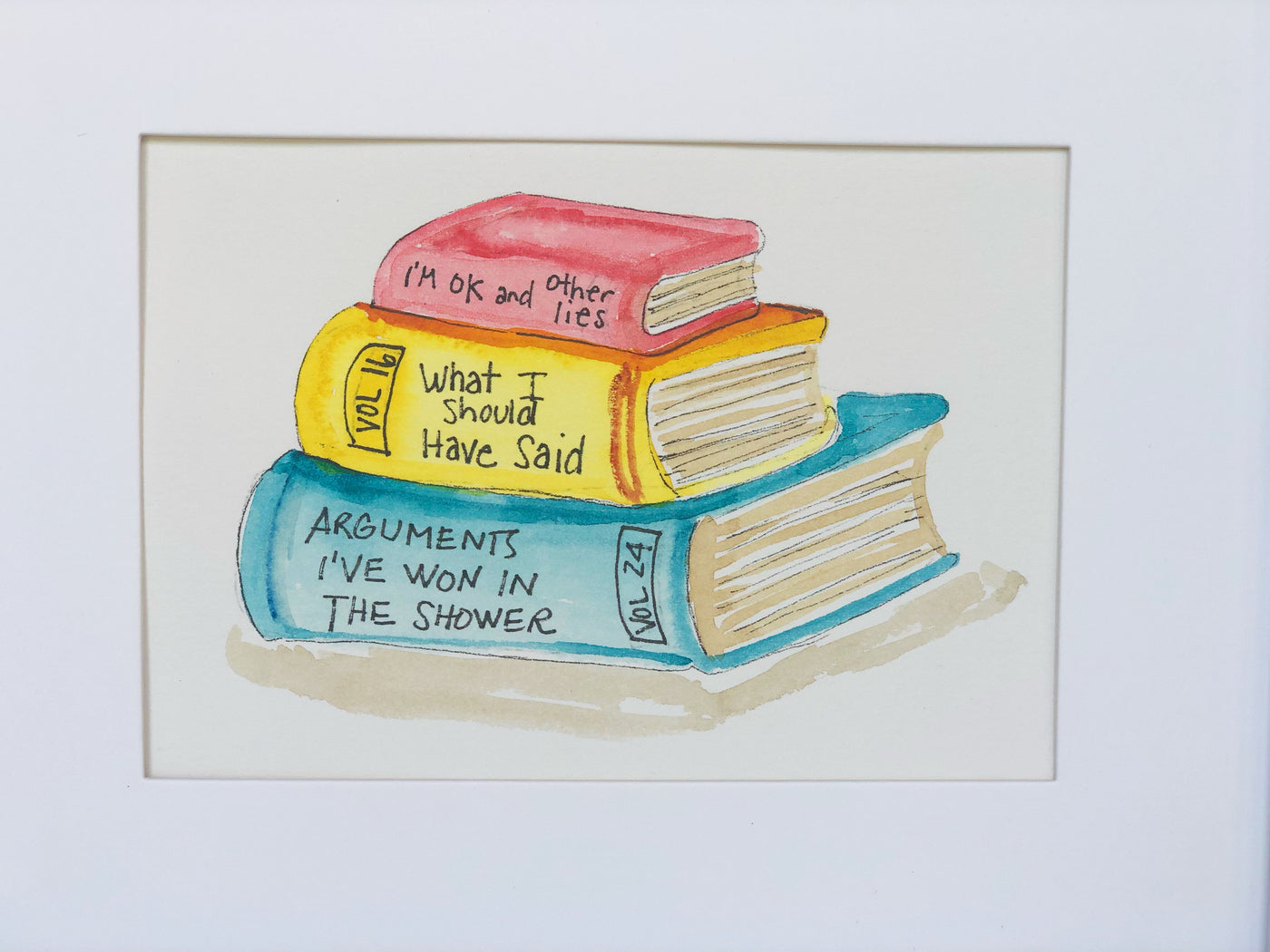 original watercolor painting of three books in red, yellow and blue