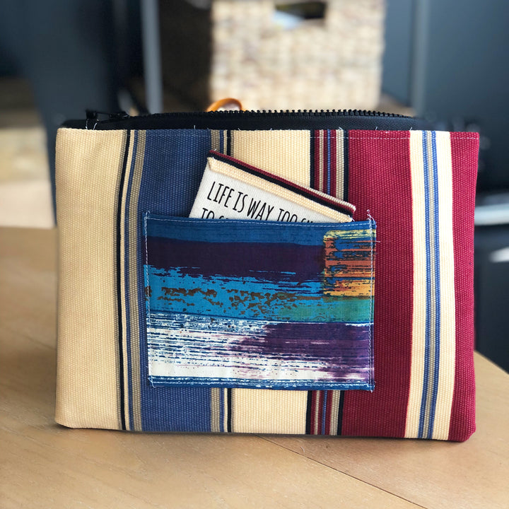 striped blue, yellow and red zip bag pouch