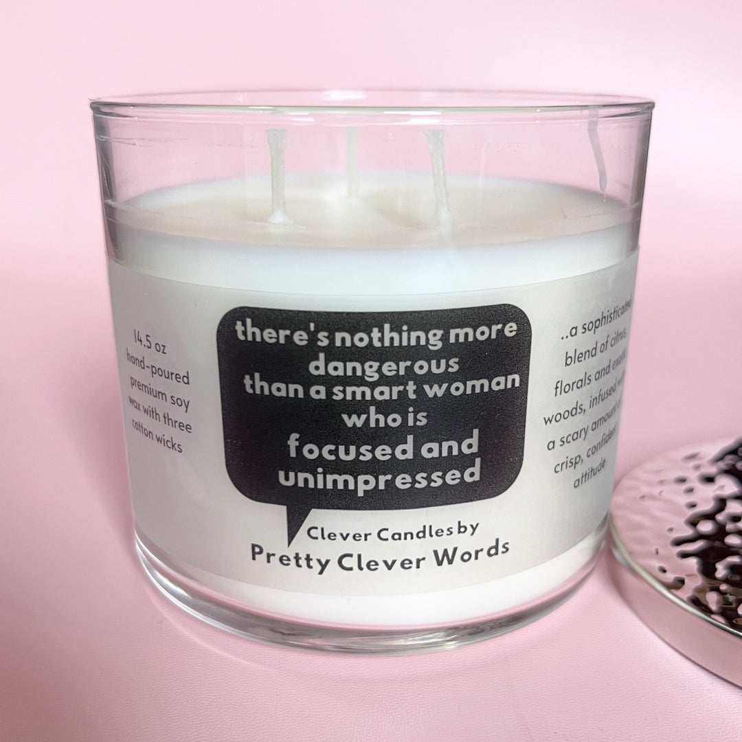 nothing is more dangerous than a smart woman, said in a word bubble - grey sophistication candle
