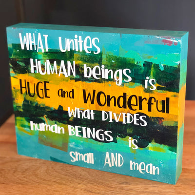 what unites human beings - wood panel art