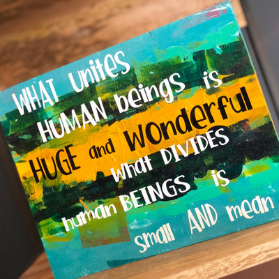 what unites human beings - wood panel art