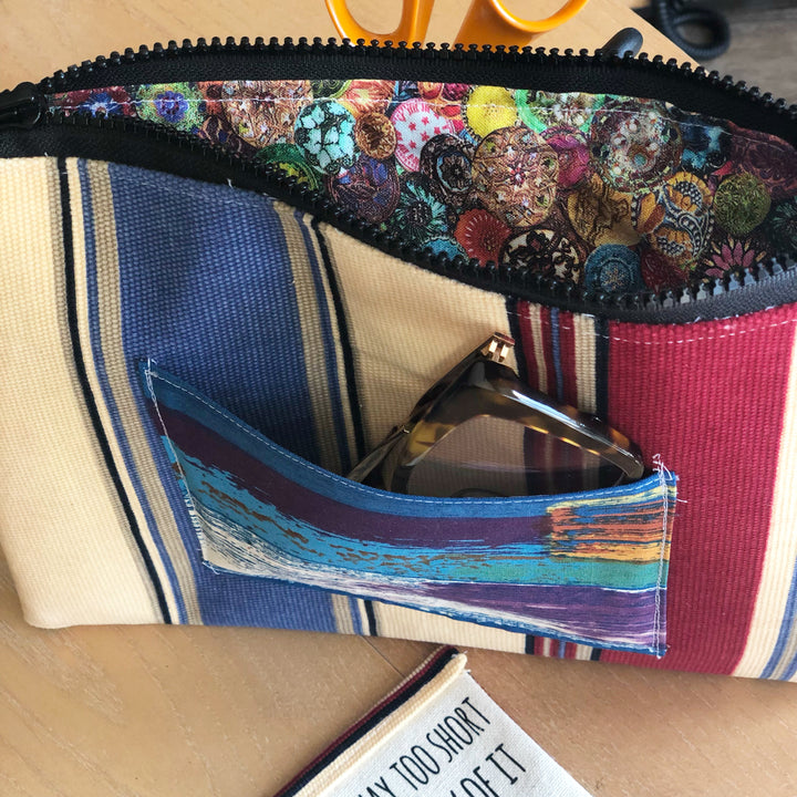 striped blue, yellow and red zip bag pouch