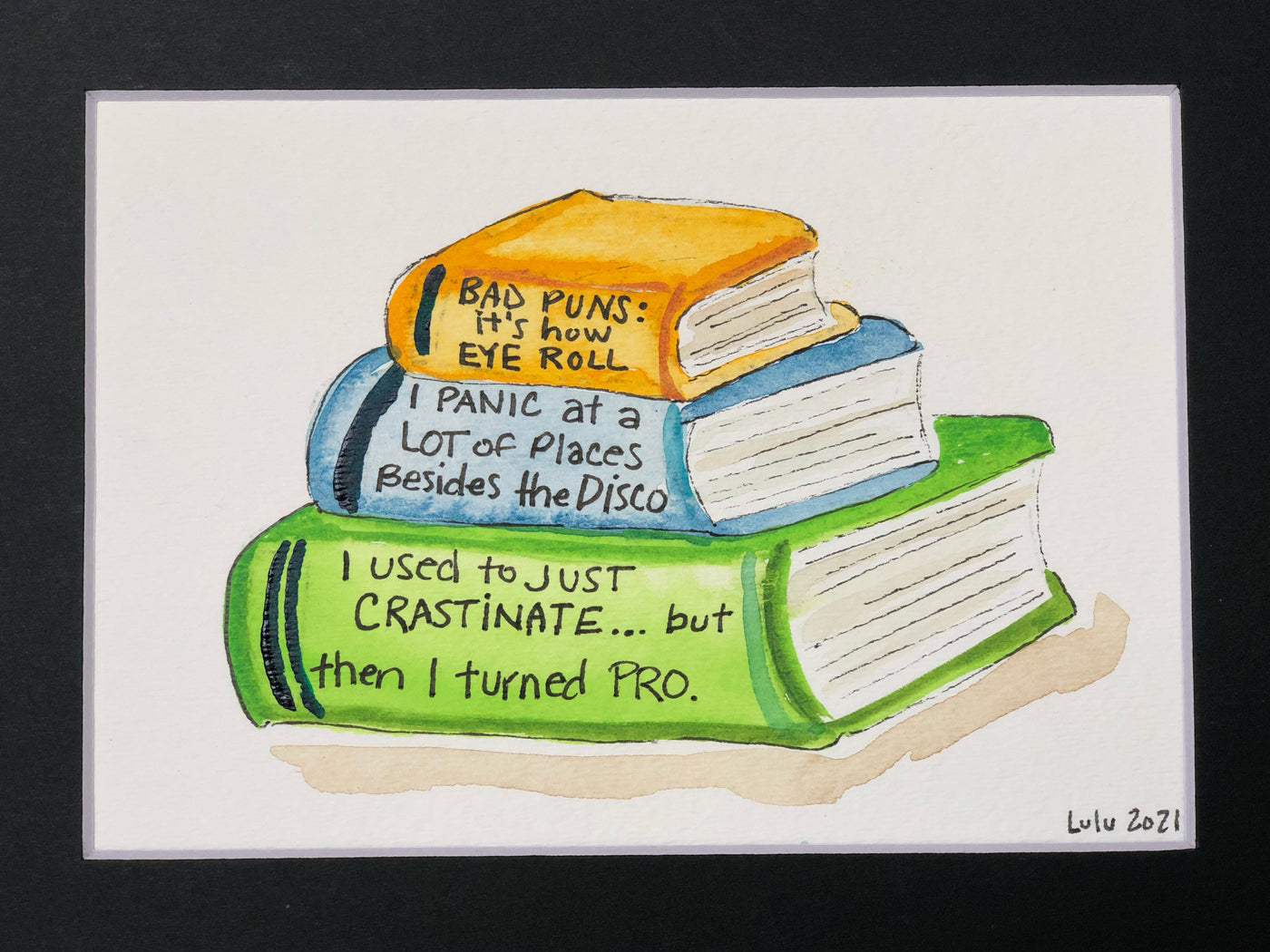 an original painted watercolor piece with three books in colors of burnt yellow, celery green and faded cerulean blue