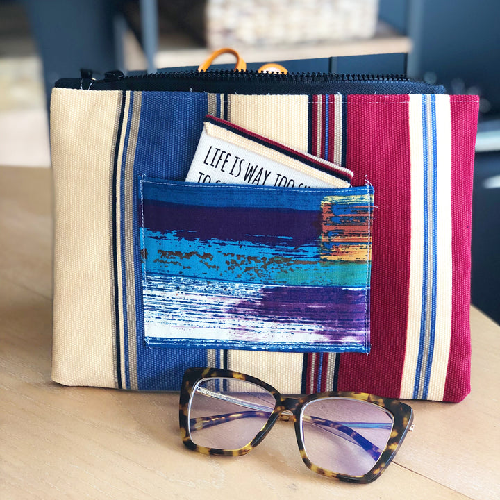 striped blue, yellow and red zip bag pouch