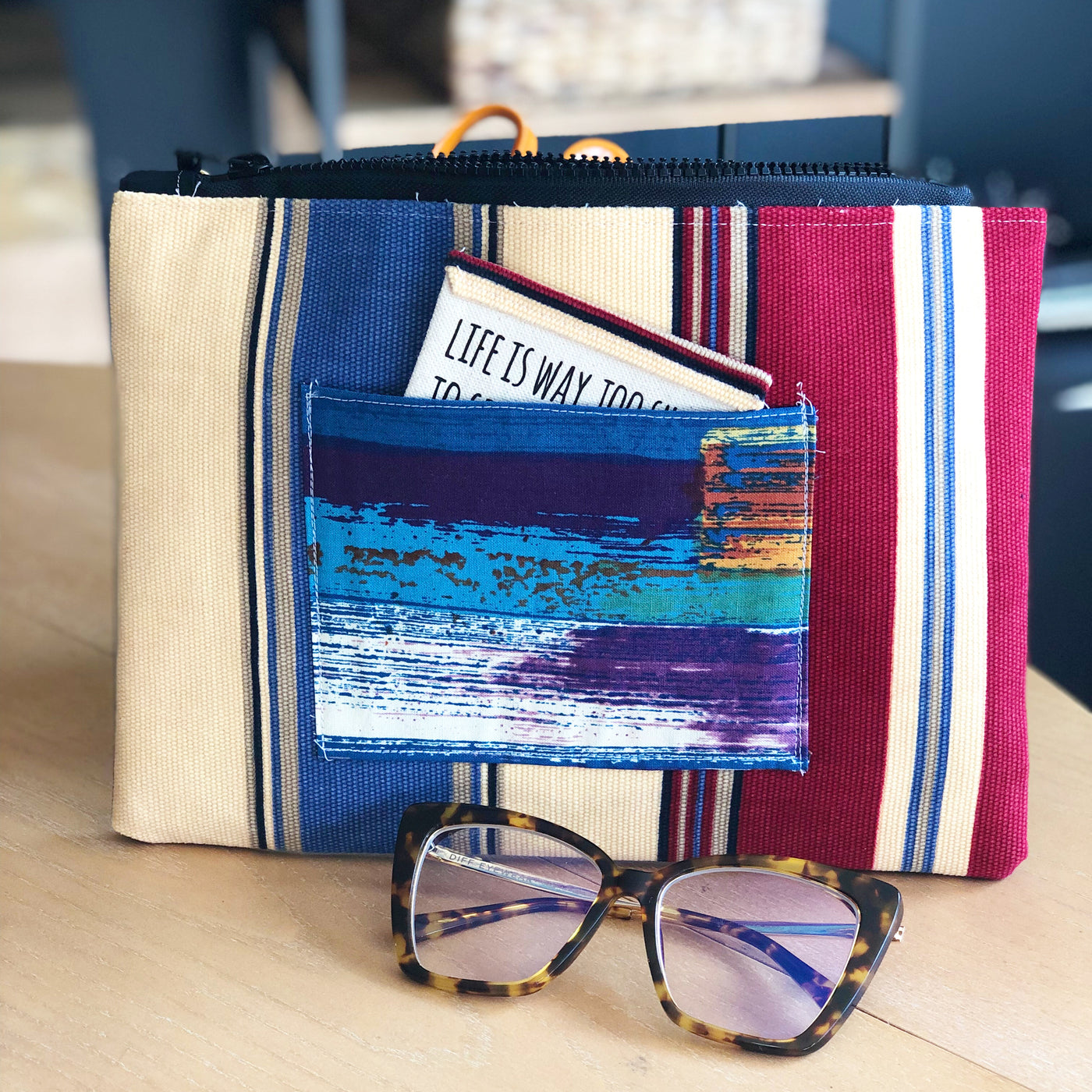 striped blue, yellow and red zip bag pouch