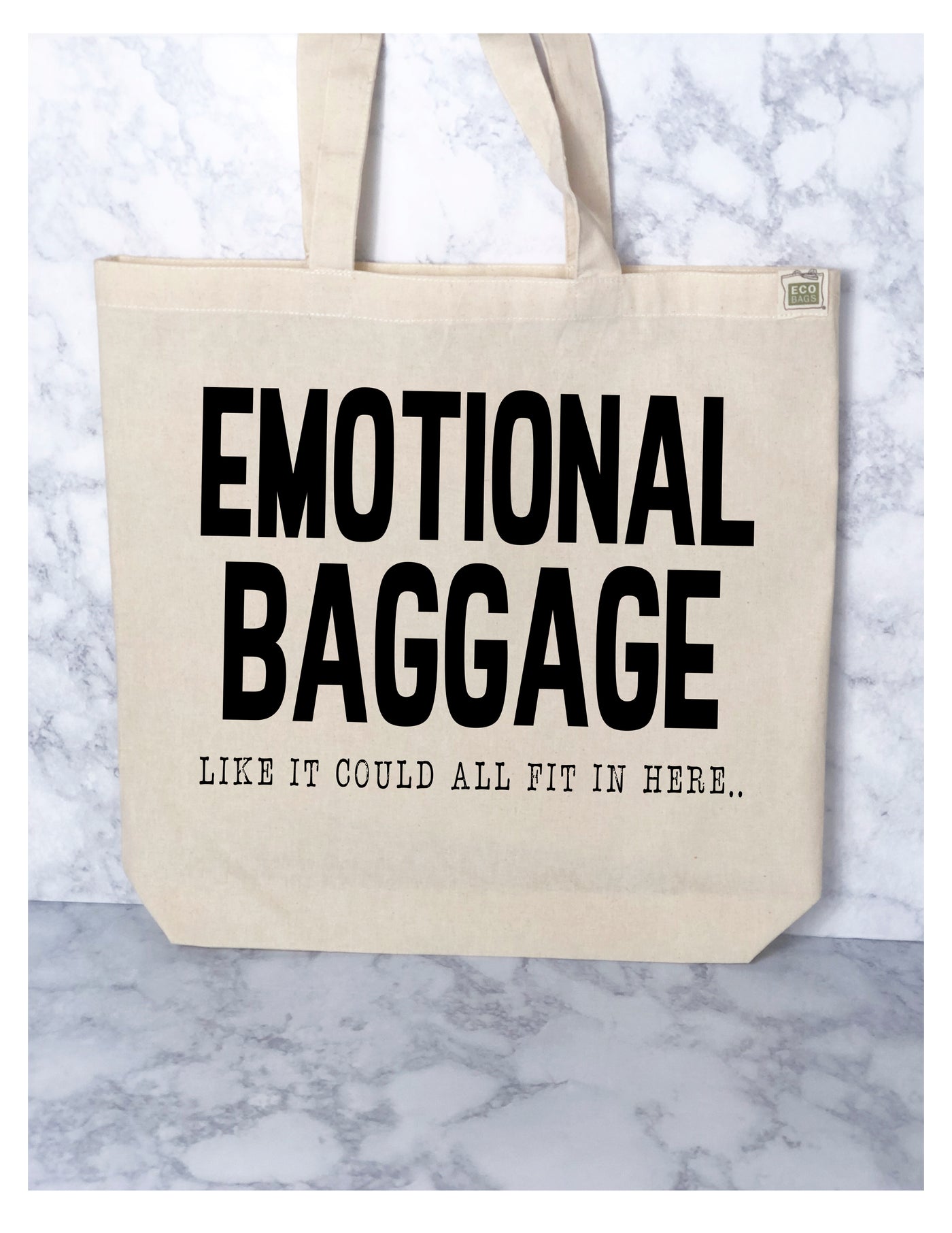 canvas tote bag with the words, Emotional Baggage, like it could all fit in here..