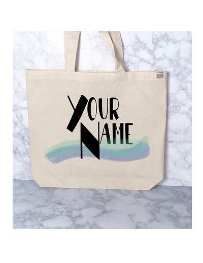 canvas tote bag with handles, with the words 'your name.' it's ready to be customized for you.