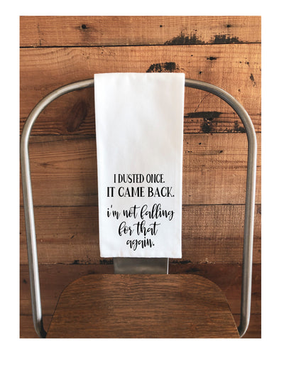 a white cotton kitchen towel with the words, "I dusted once. It came back. I'm not falling for that again."