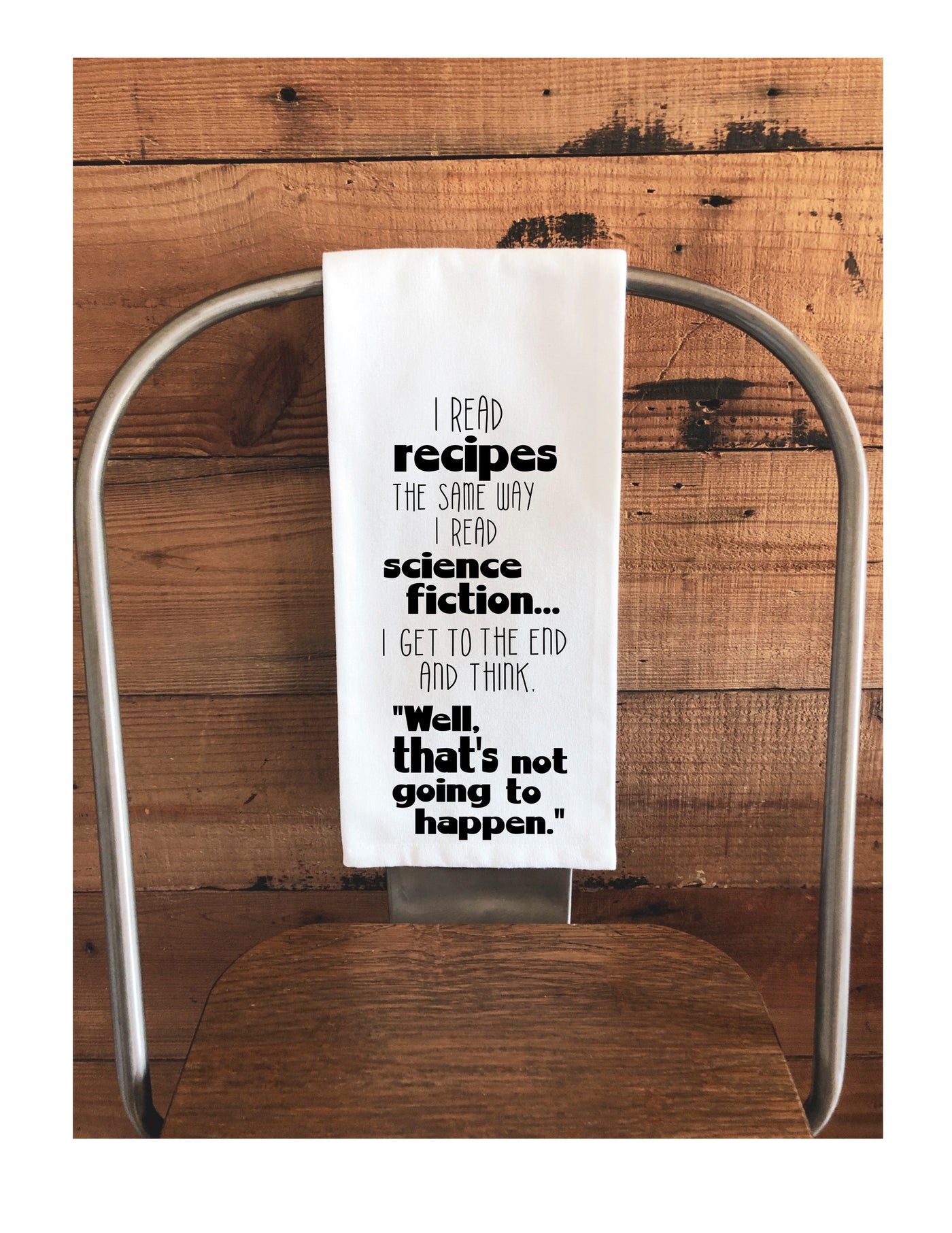 a SAMPLE of what customized kitchen towels can look like, with the words, "i read recipes the same way I read science fiction.. I get to the end and think, "well, that's not going to happen."